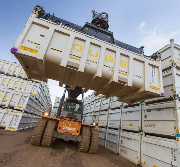 Qube container being carried by forklift