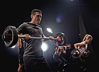 Man lifting weights in workout session