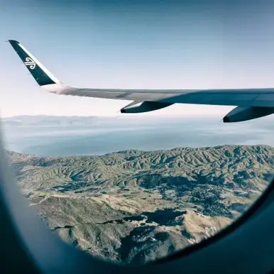 Airplane flying over the mountains
