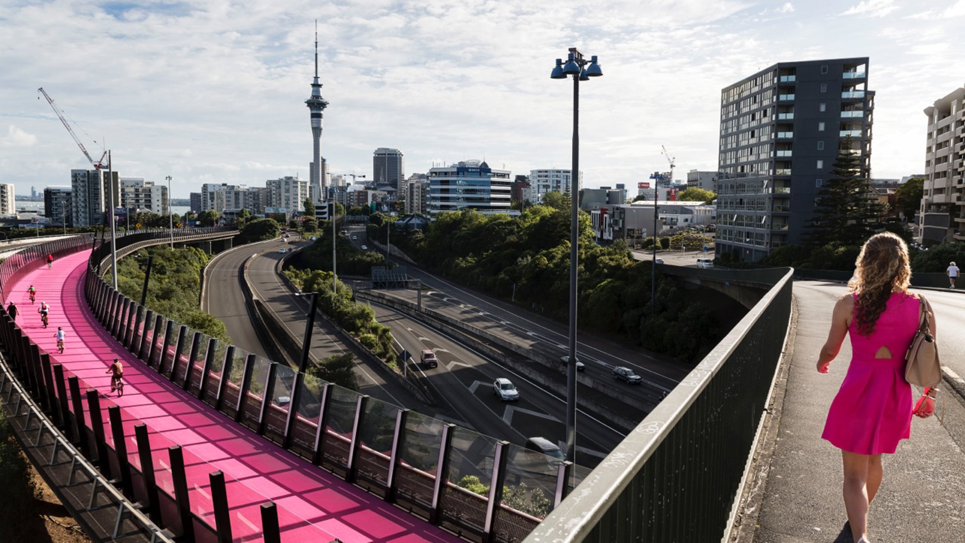 Woman walking across bridge