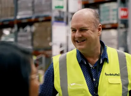 Man smiling in high-vis