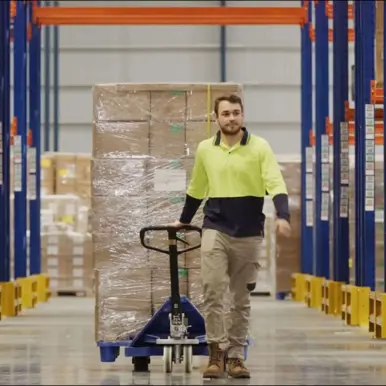 Man in warehouse aisle