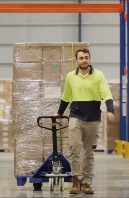 Man in warehouse aisle